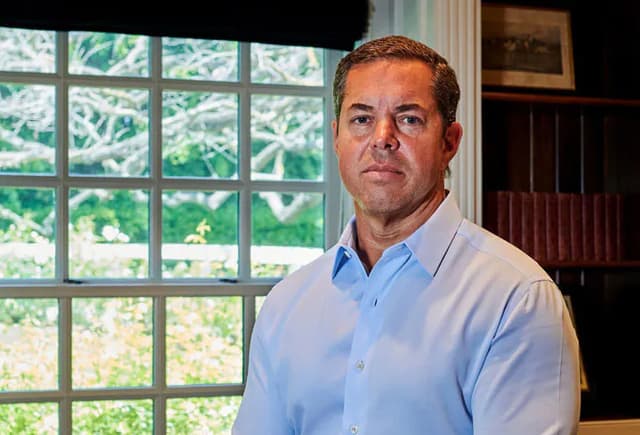 Broker Hughes Appeals Revoked License After Conviction